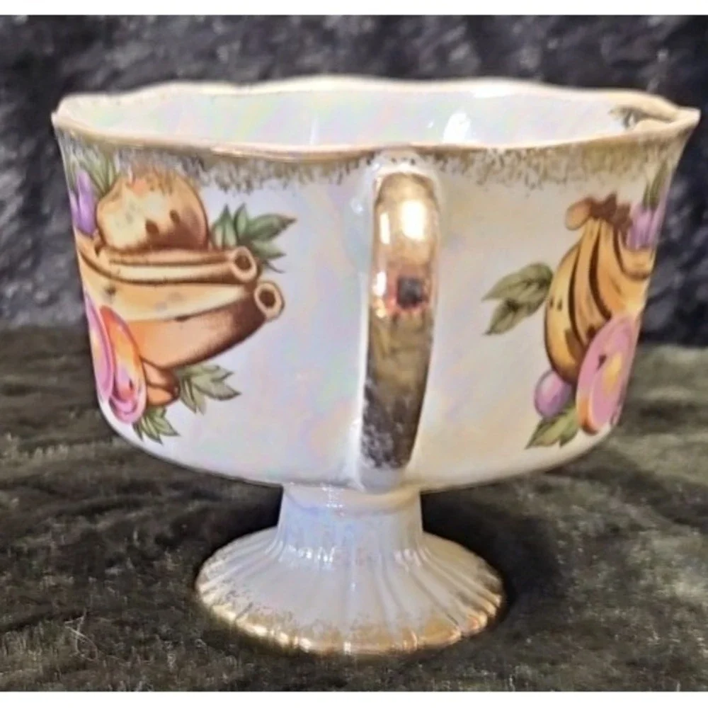 Lusterware Handpainted Fruit with gold finishings,‎ footed cup and saucer set